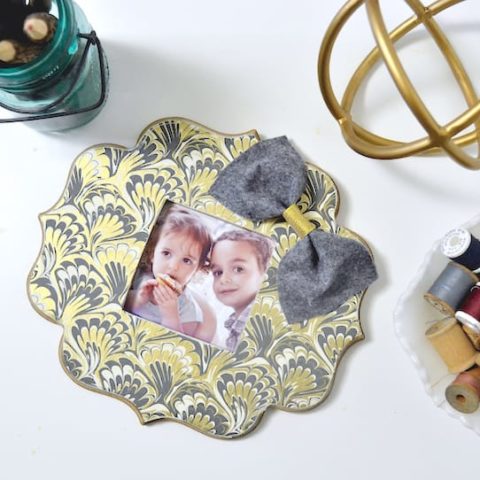 If you've ever found a beautiful piece of paper begging to be used in a craft, this DIY photo frame is perfect - so easy to make with Mod Podge!