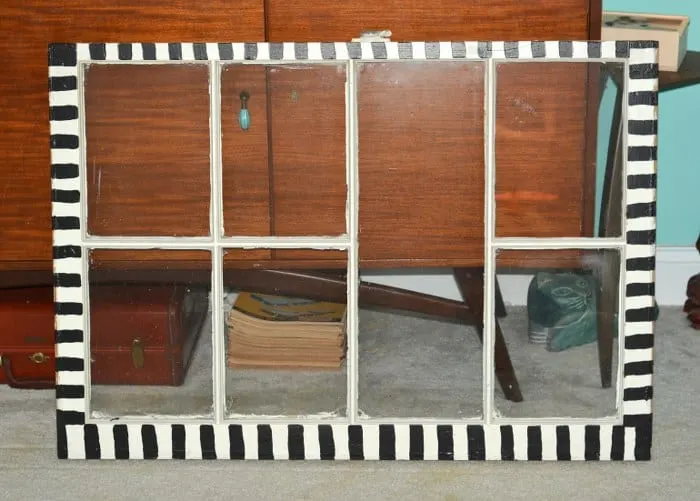 Window painted with black stripes around the edges