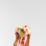 decorated mini pumpkin in a hand
