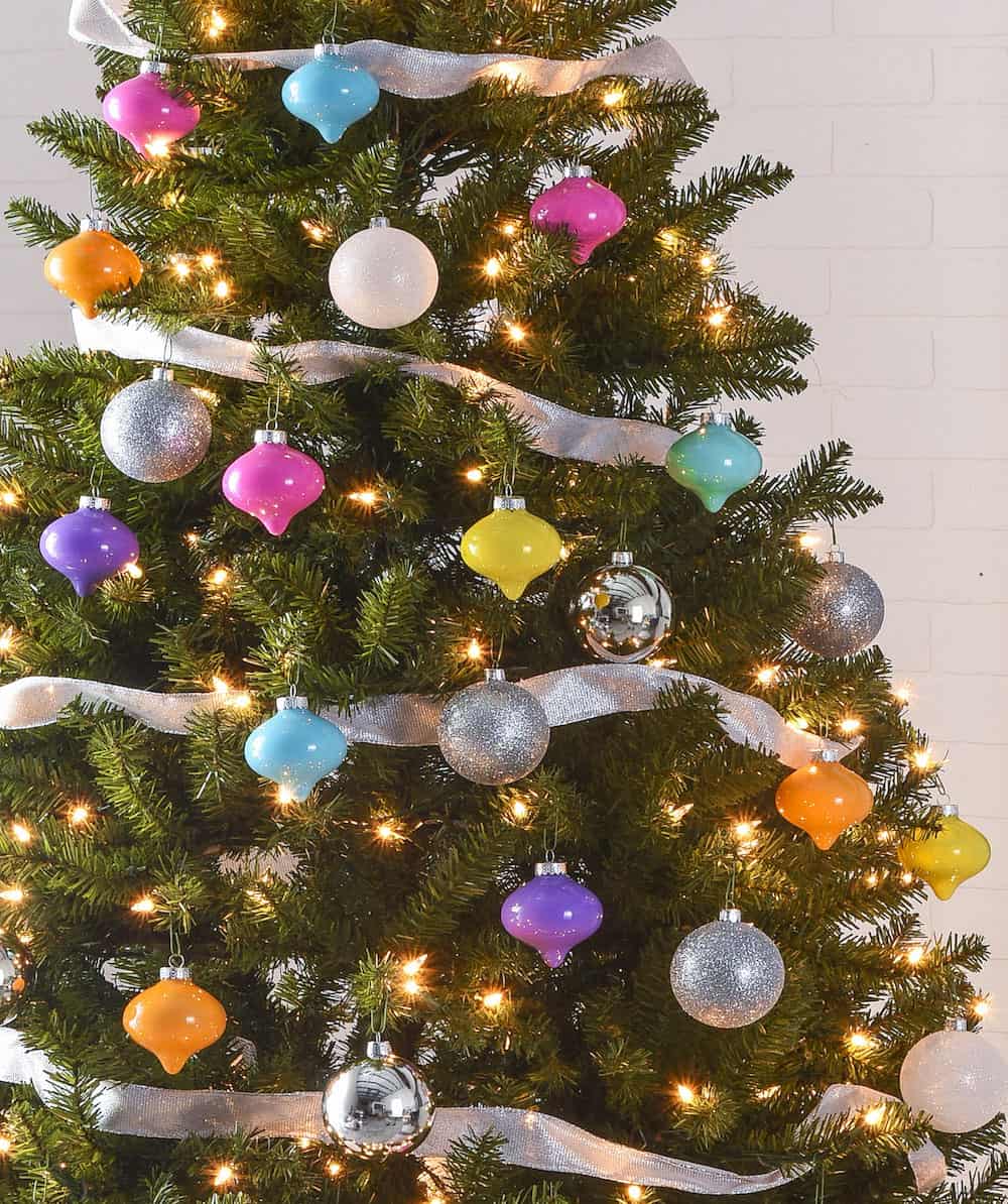 This colorful Christmas tree was inspired by a vintage palette! Learn how to make simple drop ornaments to create a tree just like this one. 