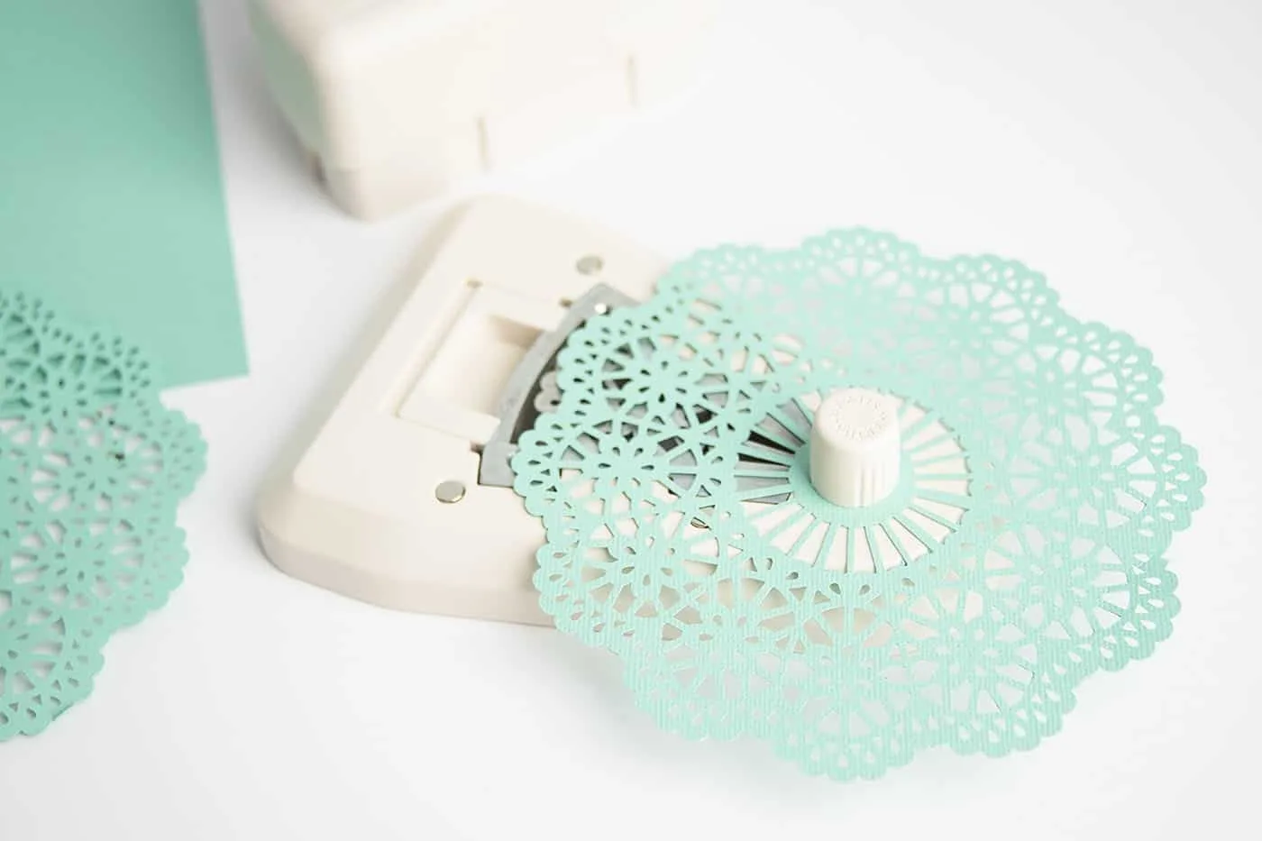 Cutting paper with a doily punch from scrapbook paper