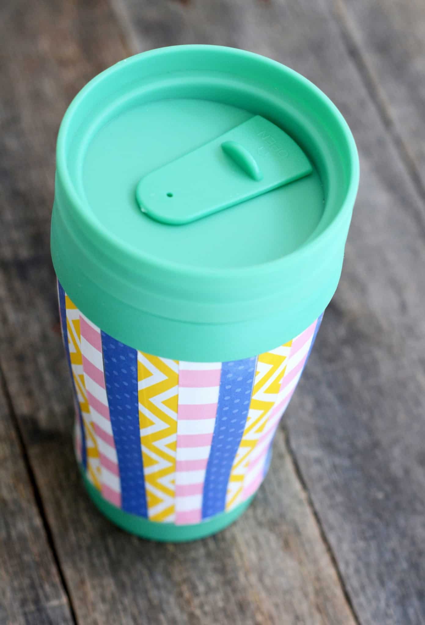 Decorate a travel mug with paper and Dishwasher Safe Mod Podge