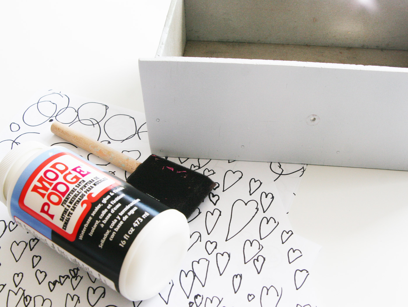 Use your kids' artwork to re-do a furniture piece in this fun dresser makeover. You'll love decoupaging as much as your children love the drawing!
