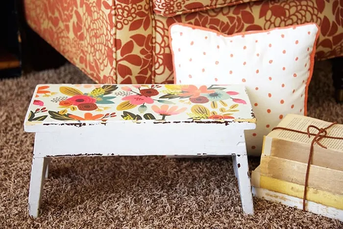 Makeover a stool with Mod Podge and paper