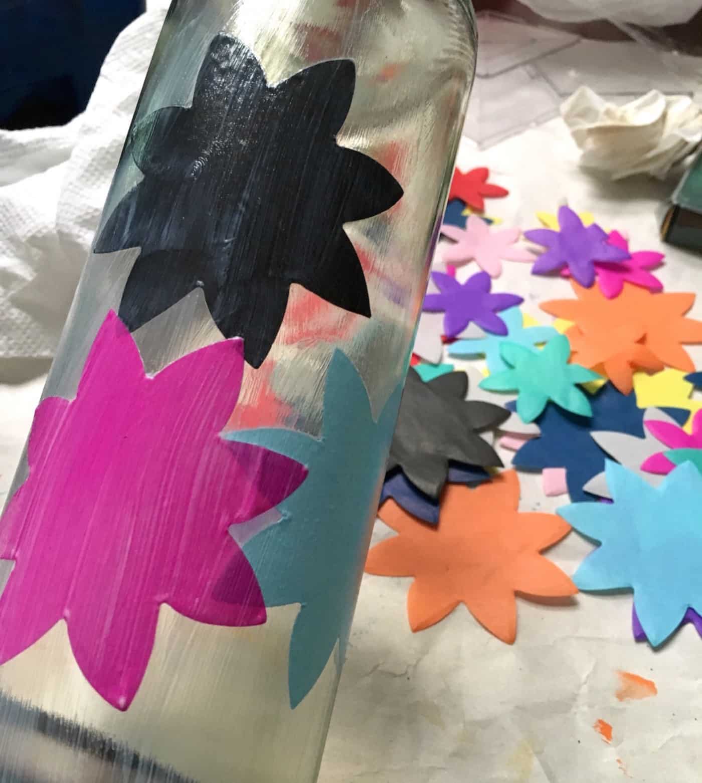 Star shapes Mod Podged to a clear wine bottle