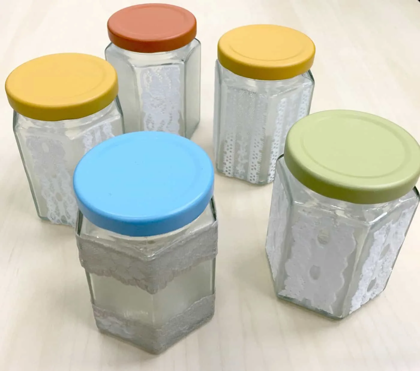 Lace mason jars with spray painted lids
