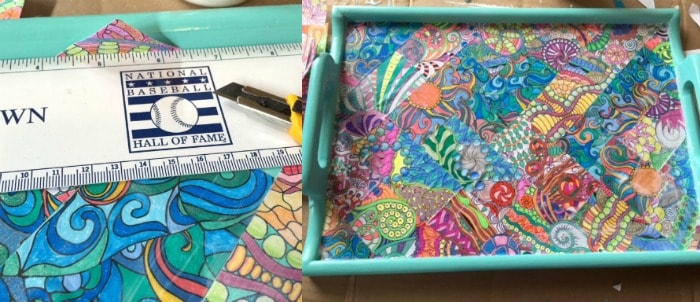 Trimming the edges of the coloring pages inside the tray