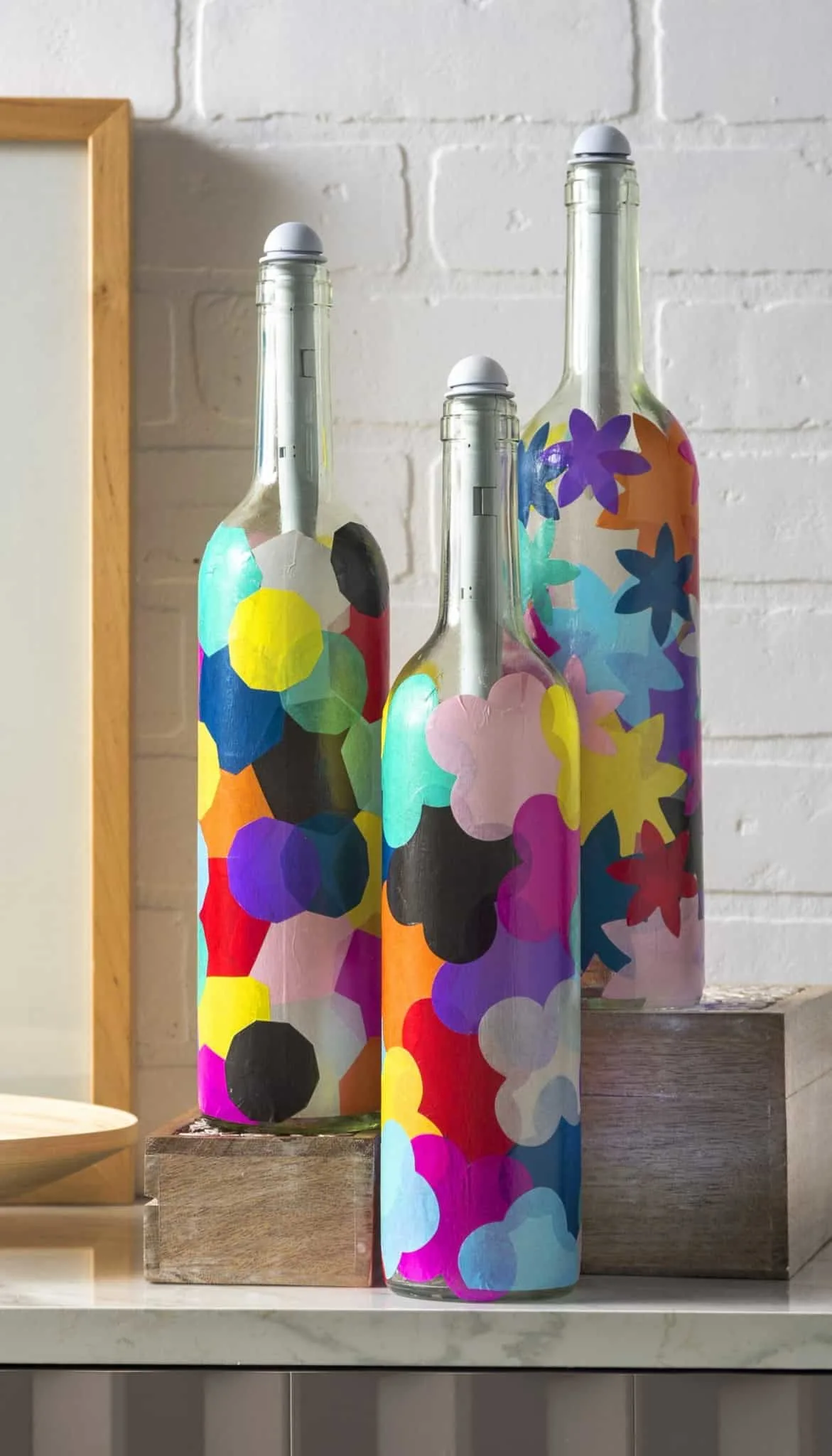 Mod Podge wine bottles with tissue paper shapes