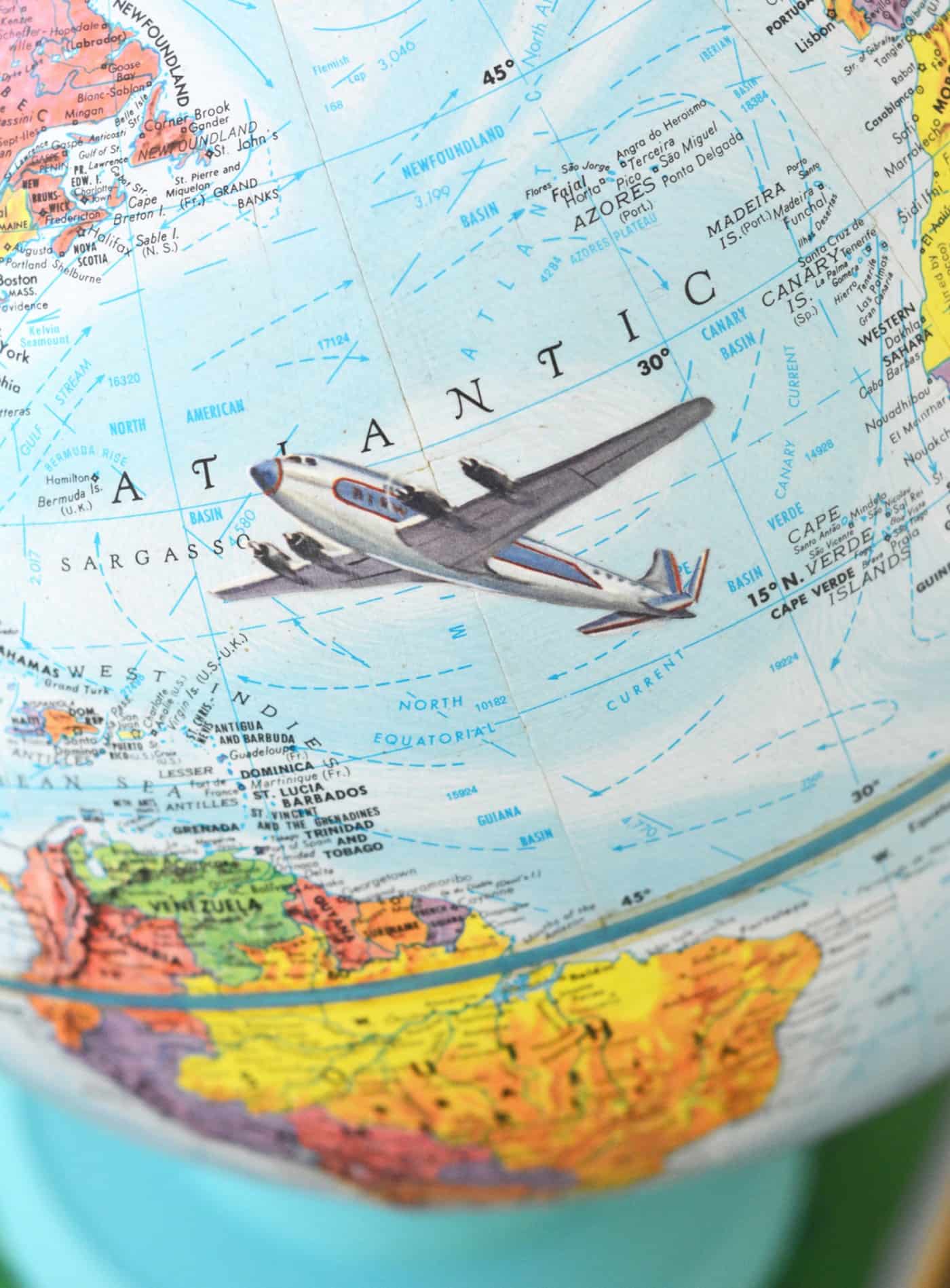 Close up of the decoupage globe with the plane graphic