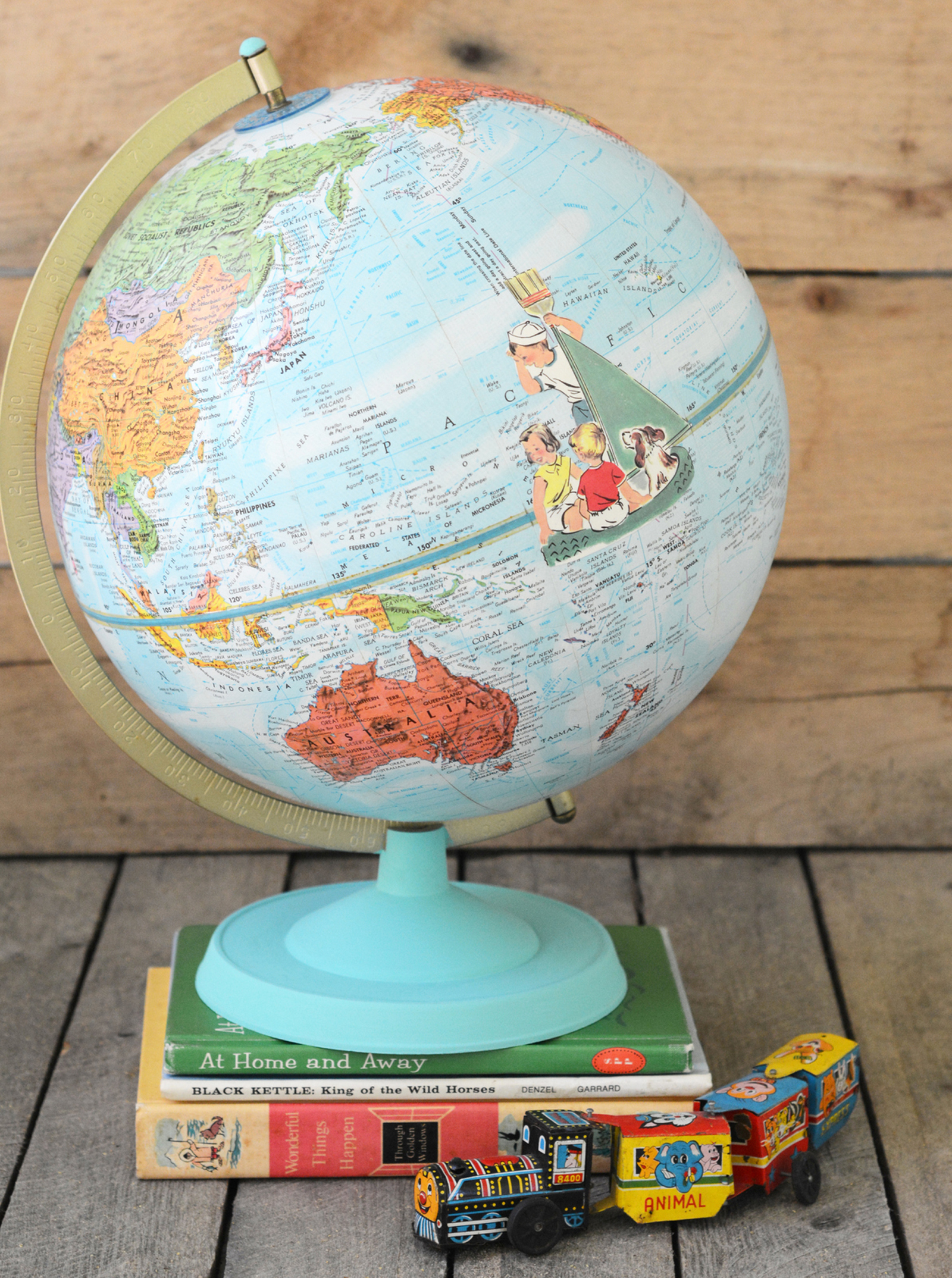 Learn how to customize a vintage globe with your favorite images from children's books - this is such a unique home decor project!