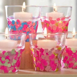 Are you ready to party?? Decorate simple glass candle holders with inexpensive confetti. Perfect for a celebration or just fun home decor! Easy, too.