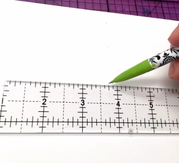 Draw a line with a pencil and clear ruler