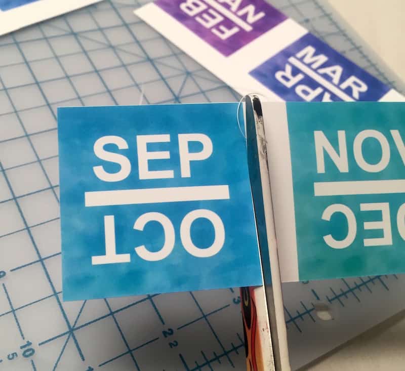 Cutting out the month labels with scissors