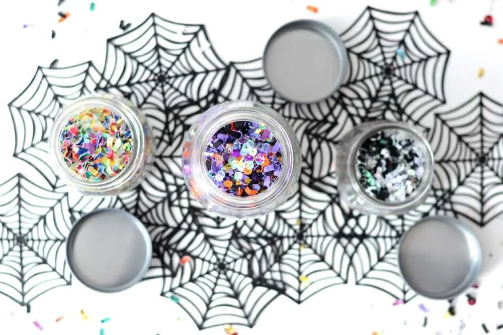 Confetti added to Halloween party favor jars