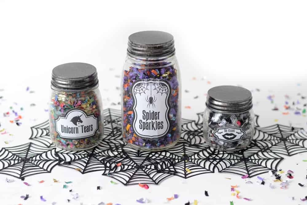 Unicorn tears spider sparkles and bat kisses confetti jars filled with Halloween confetti