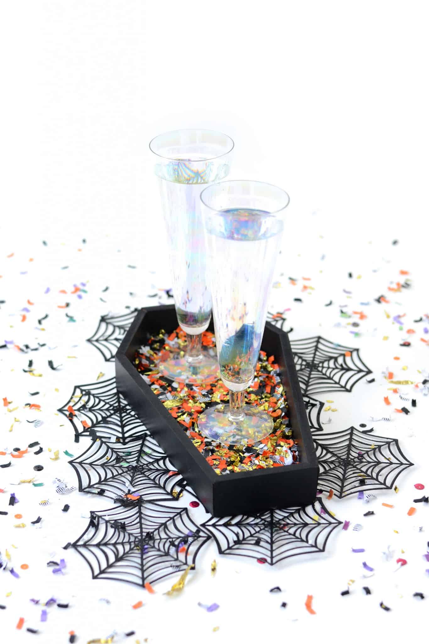 Spice up your Halloween table with DIY confetti coffin tray! It makes the perfect decoration for your next holiday soirée. And who doesn't love confetti?!