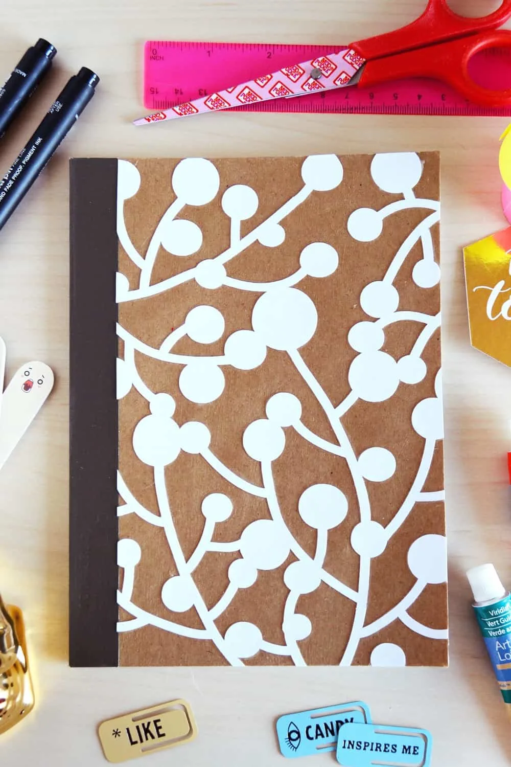 How to decorate a notebook with die cut paper and Mod Podge