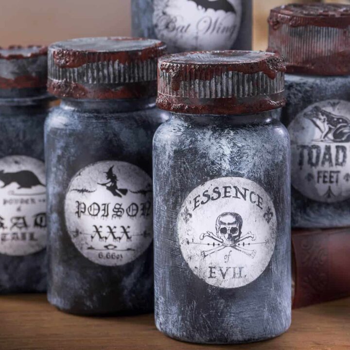 Learn how to make these cool Halloween potion bottles from old pill bottles! Grab free printables in this post, a bottle of Mod Podge, and some paint.