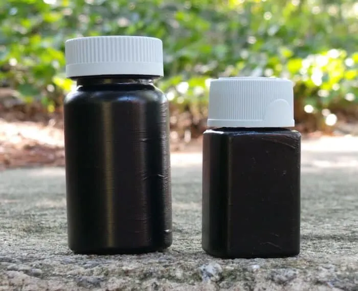 Painted pill bottles with black paint