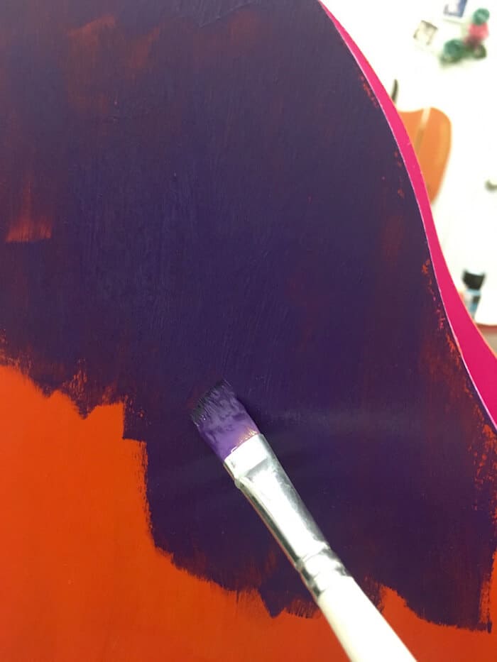 Painting purple over the base color of orange