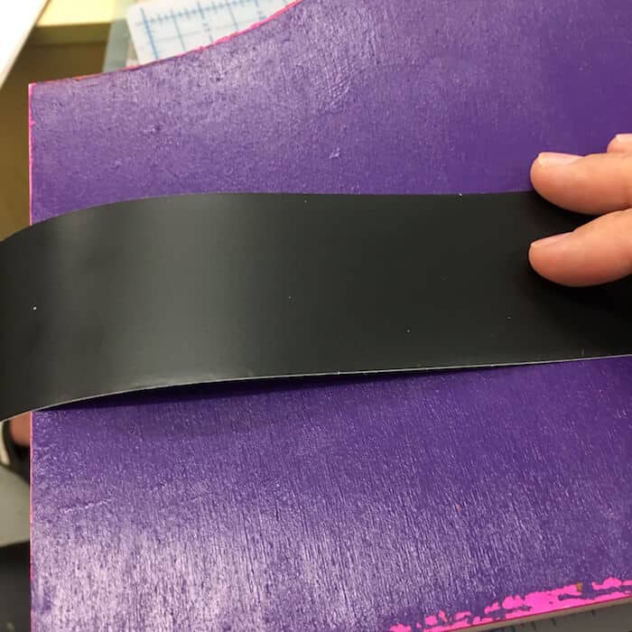 Adding a piece of chalkboard tape to the outside of the magazine holder