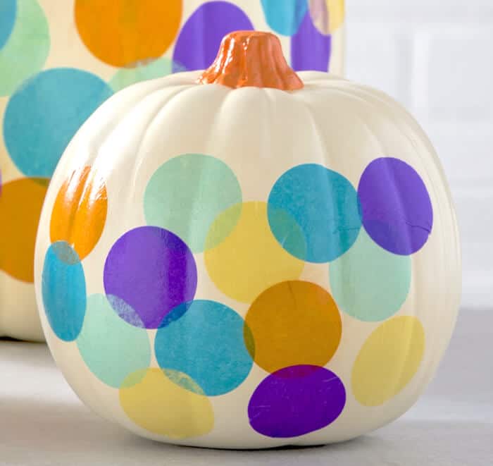 Decorate a pumpkin with confetti and Mod Podge