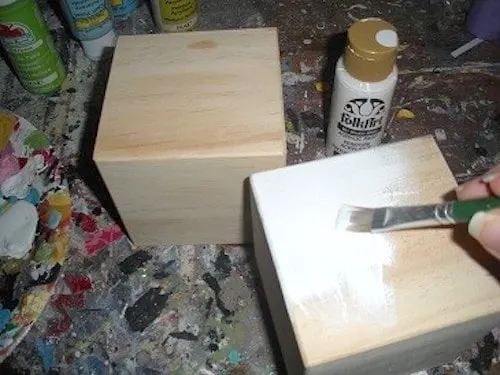 Painting a wood block with white acrylic paint