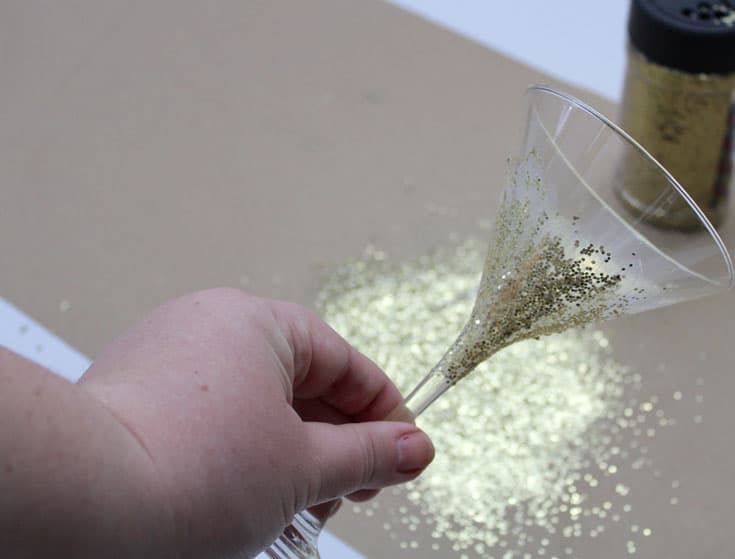 Adding glitter to a glass with mod podge