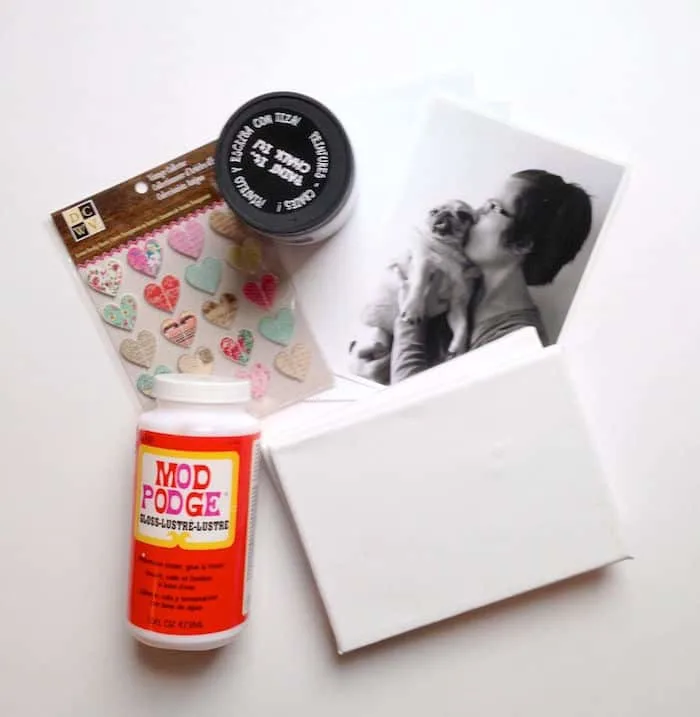 Canvases, printed photo, black paint, Mod Podge, and heart stickers