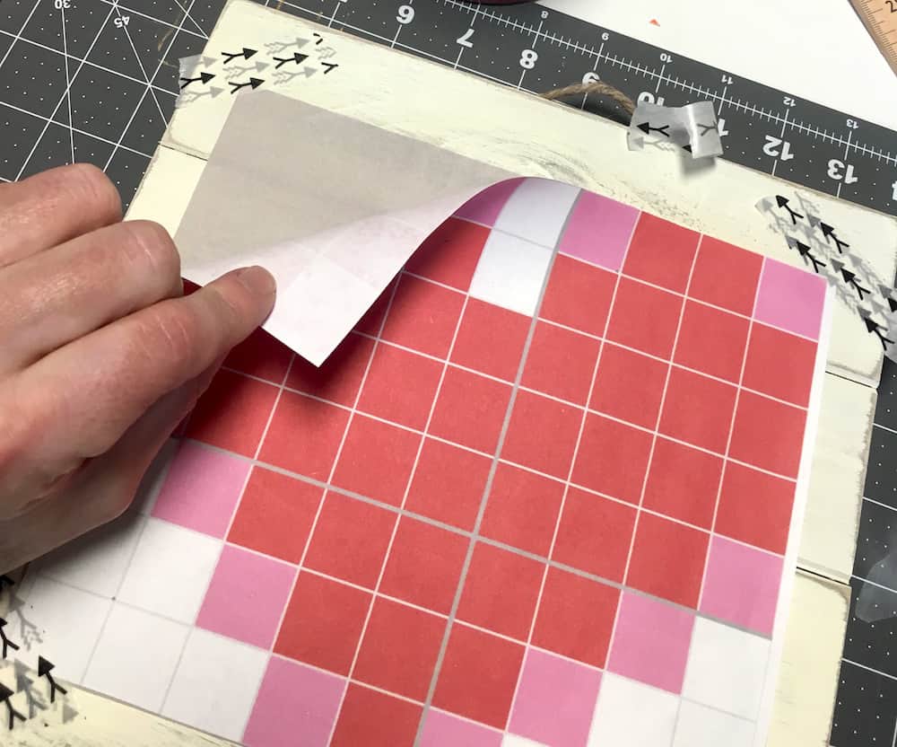 Make this simple and pretty Valentine's Day art using a wood pallet and Duck Tape! So easy, even a kid can do it. Use this cross stitch idea for a variety of designs.