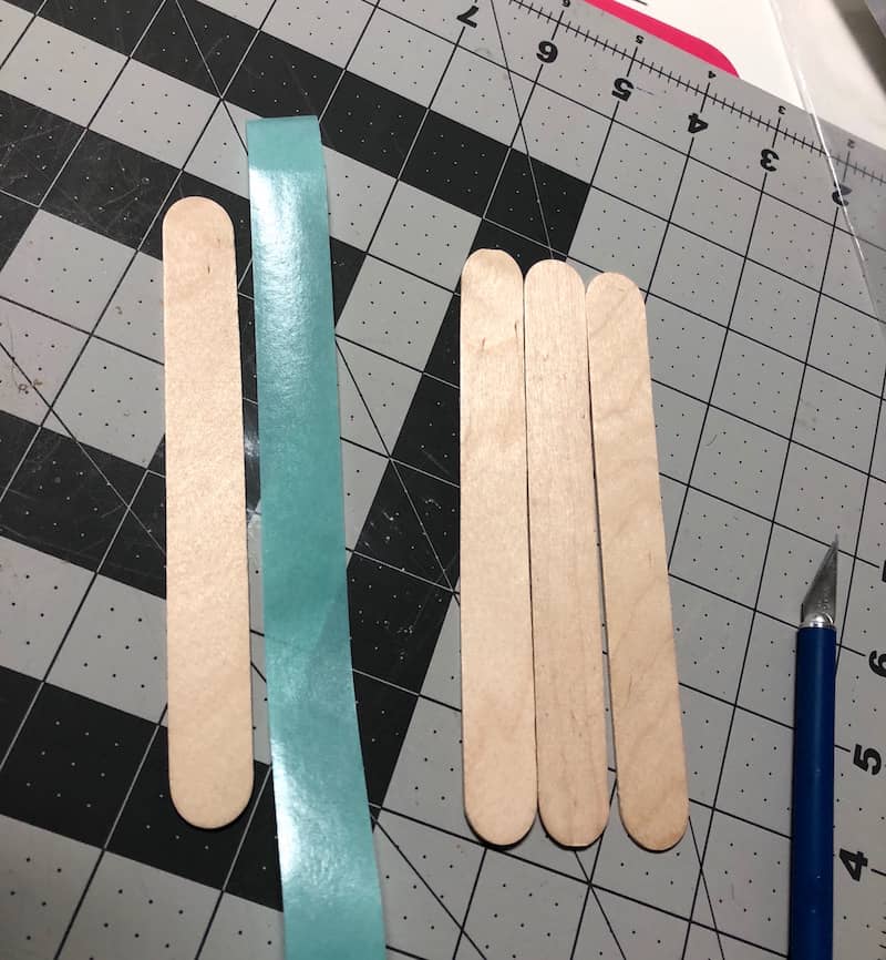 Popsicle stick frame attaching washi tape