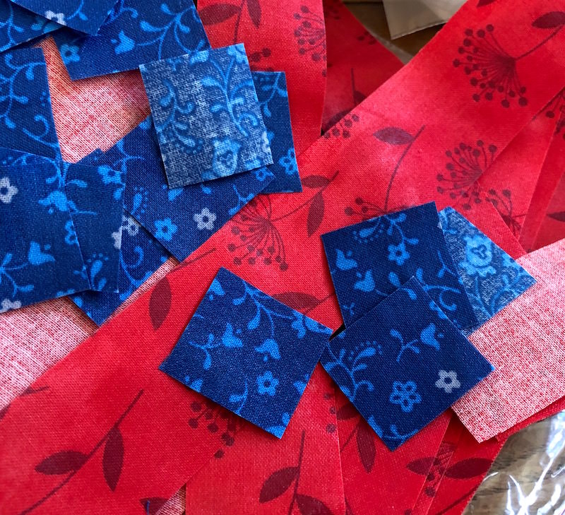 Blue and red fabric scraps