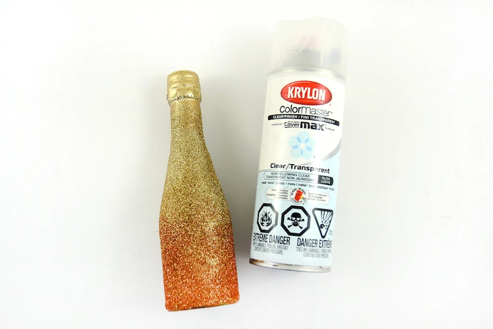 glittered bottle and Krylon clear spray sealer