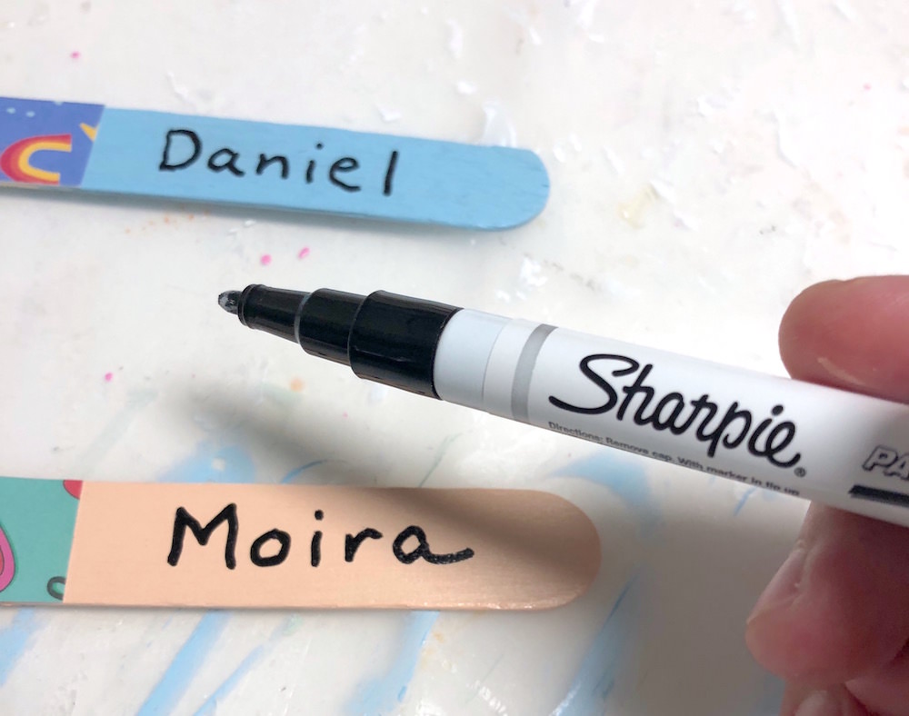 Write on popsicle sticks with a Sharpie