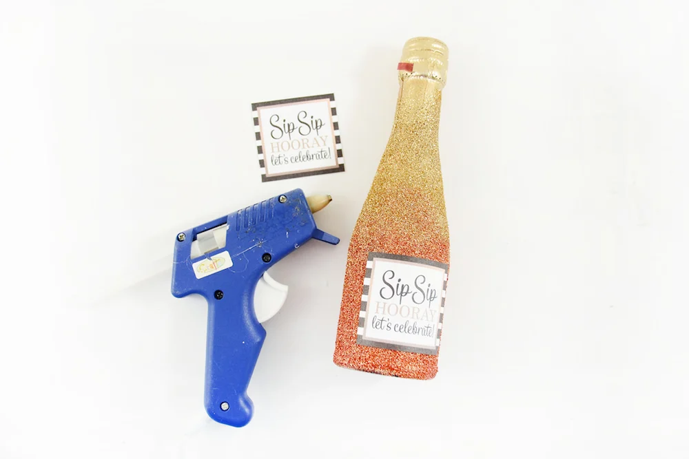 Attach your labels to the mini wine bottles