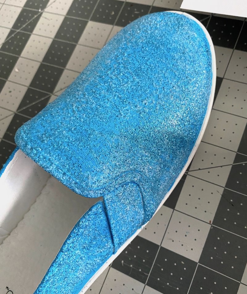 First coat of Mod Podge and glitter on canvas shoes