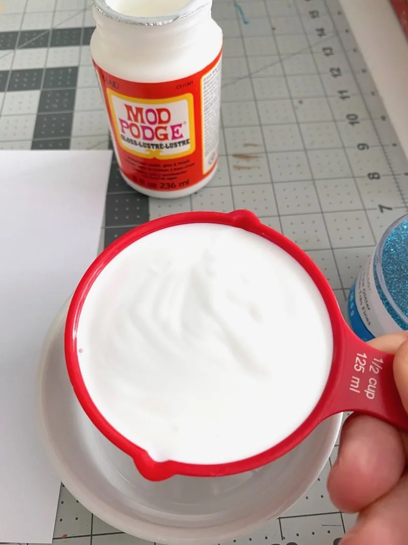 Mod Podge in a measuring cup