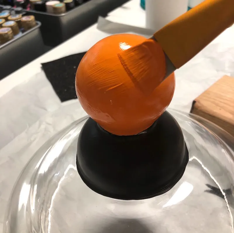 Paint the glass handle orange