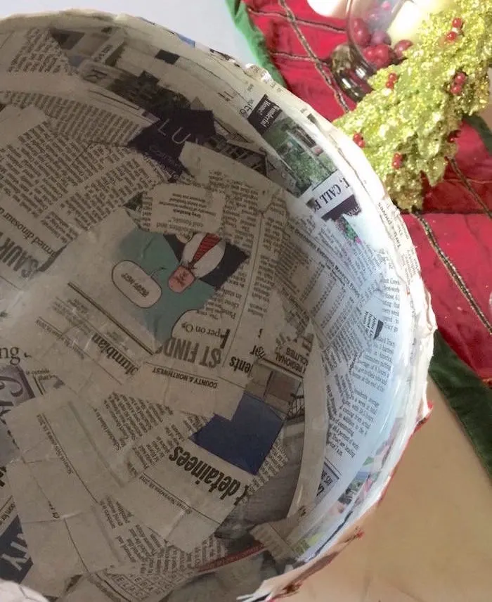 Balloon covered in newspaper strips and Mod Podge