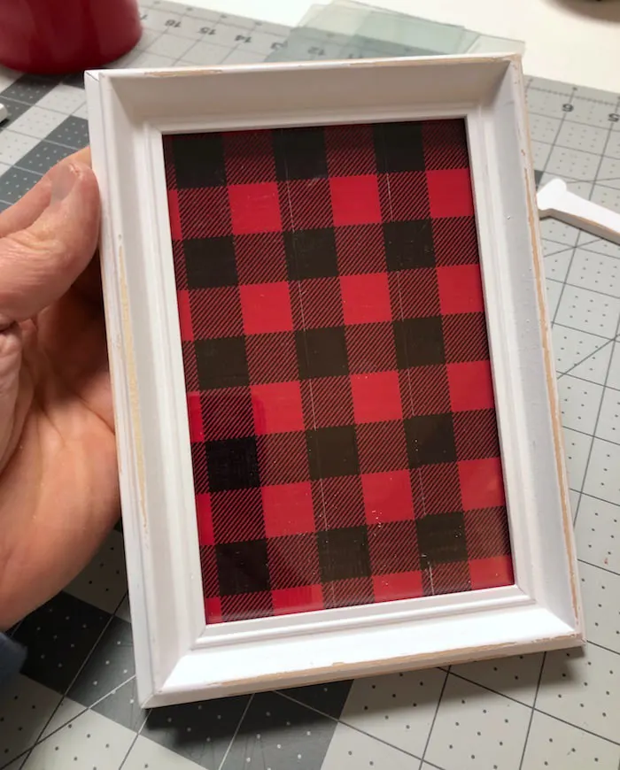 Stick the plaid backer in the frame