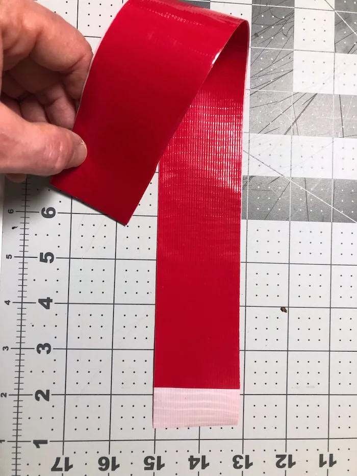 Bending two pieces of red Duck Tape stuck together