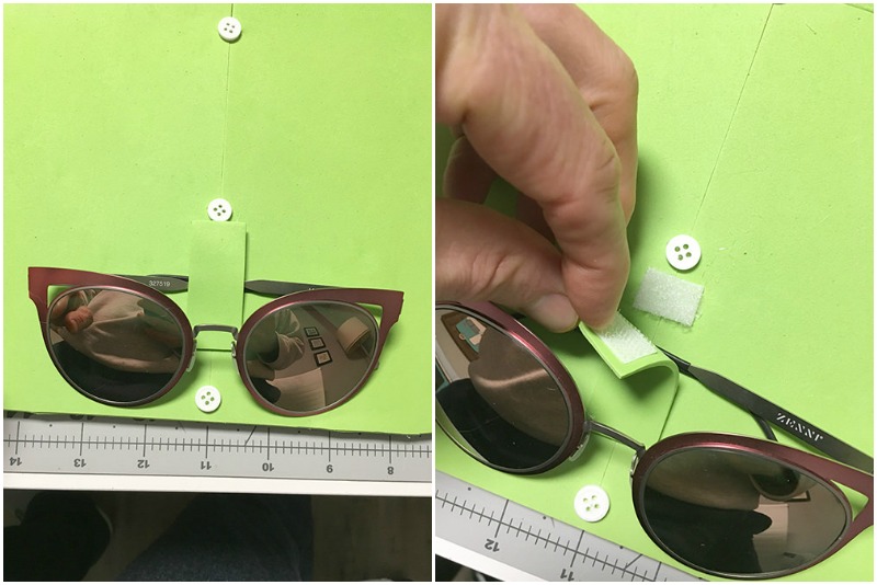 Closing a velcro tab to hold glasses on a glasses holder