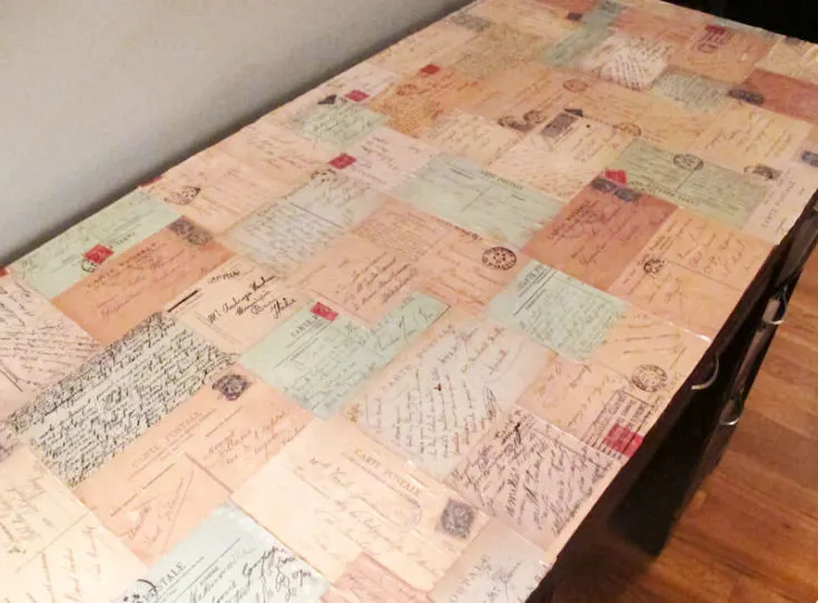 Decoupage desk with postcards