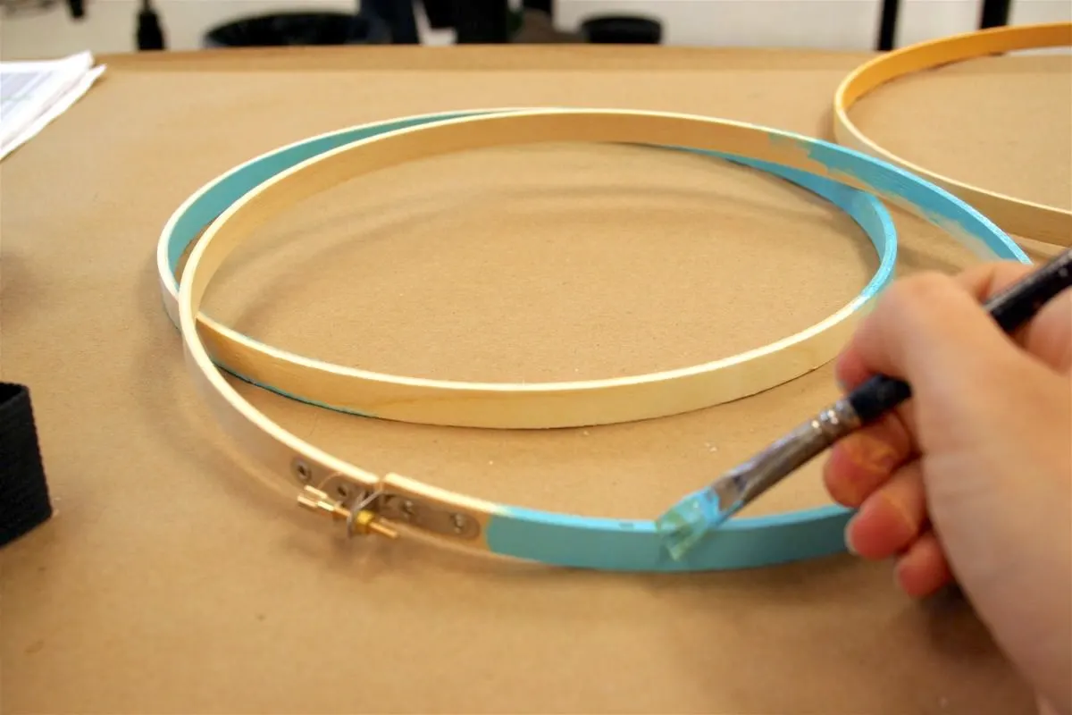 Painting embroidery hoops with blue paint