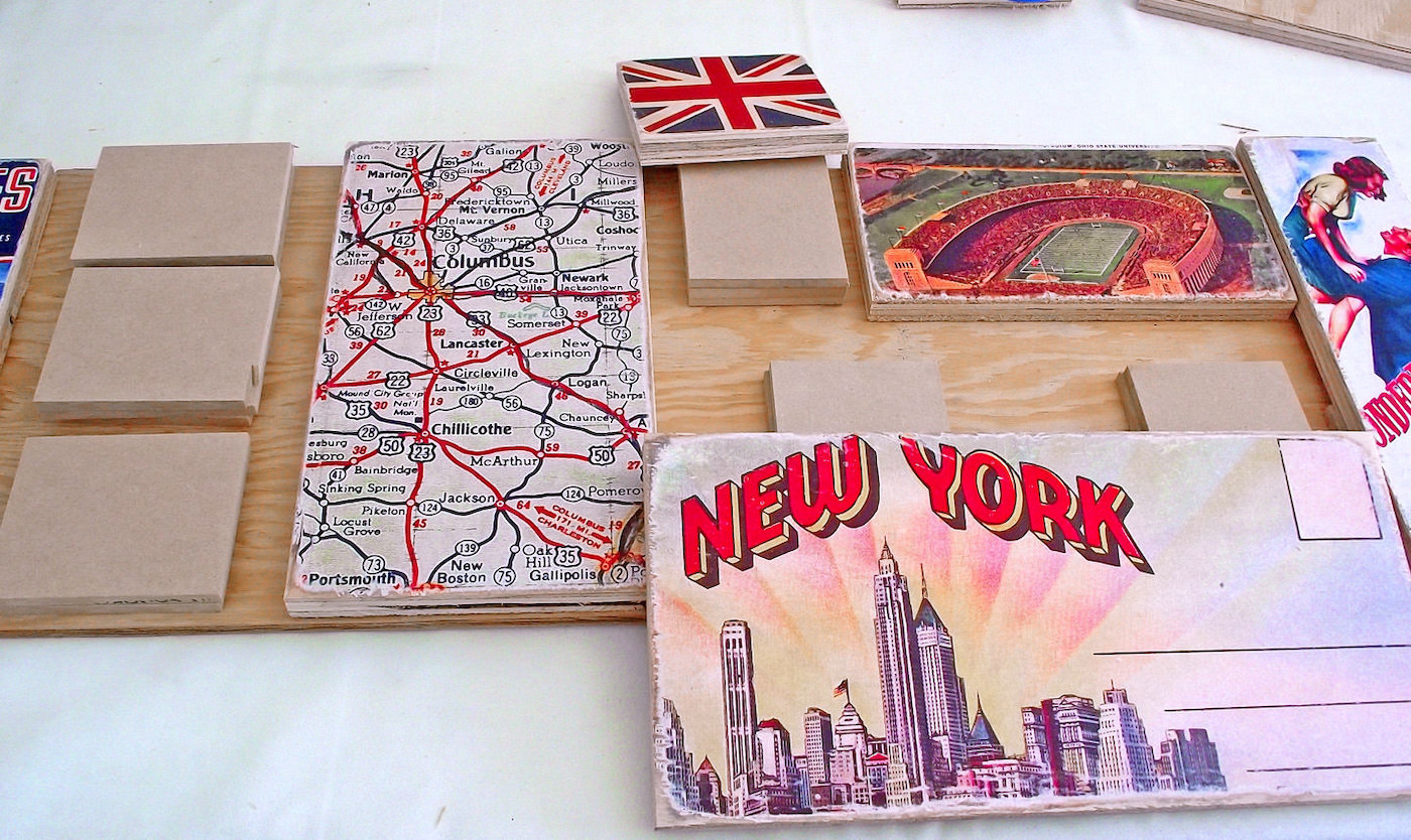 Various wood blocks with graphics decoupaged on top