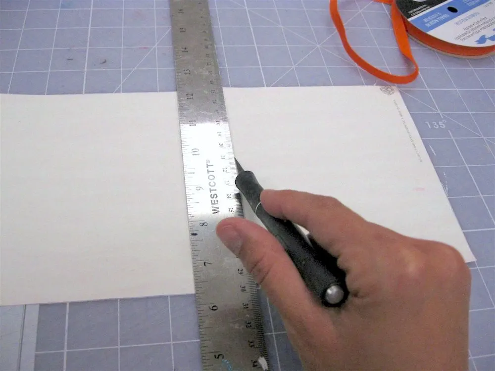 Trim the paper with the craft knife and ruler