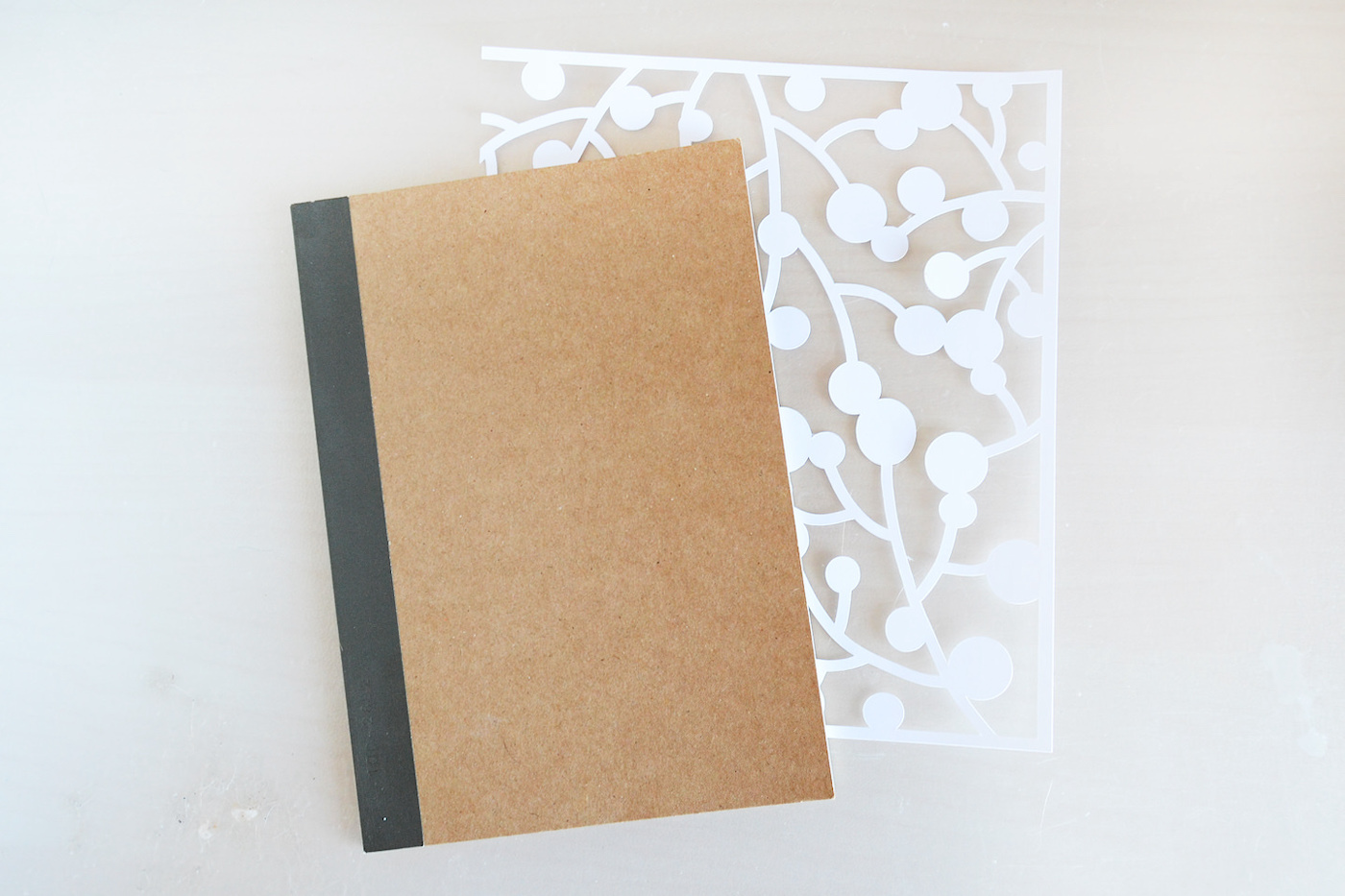Plain notebook and a scrapbook paper overlay