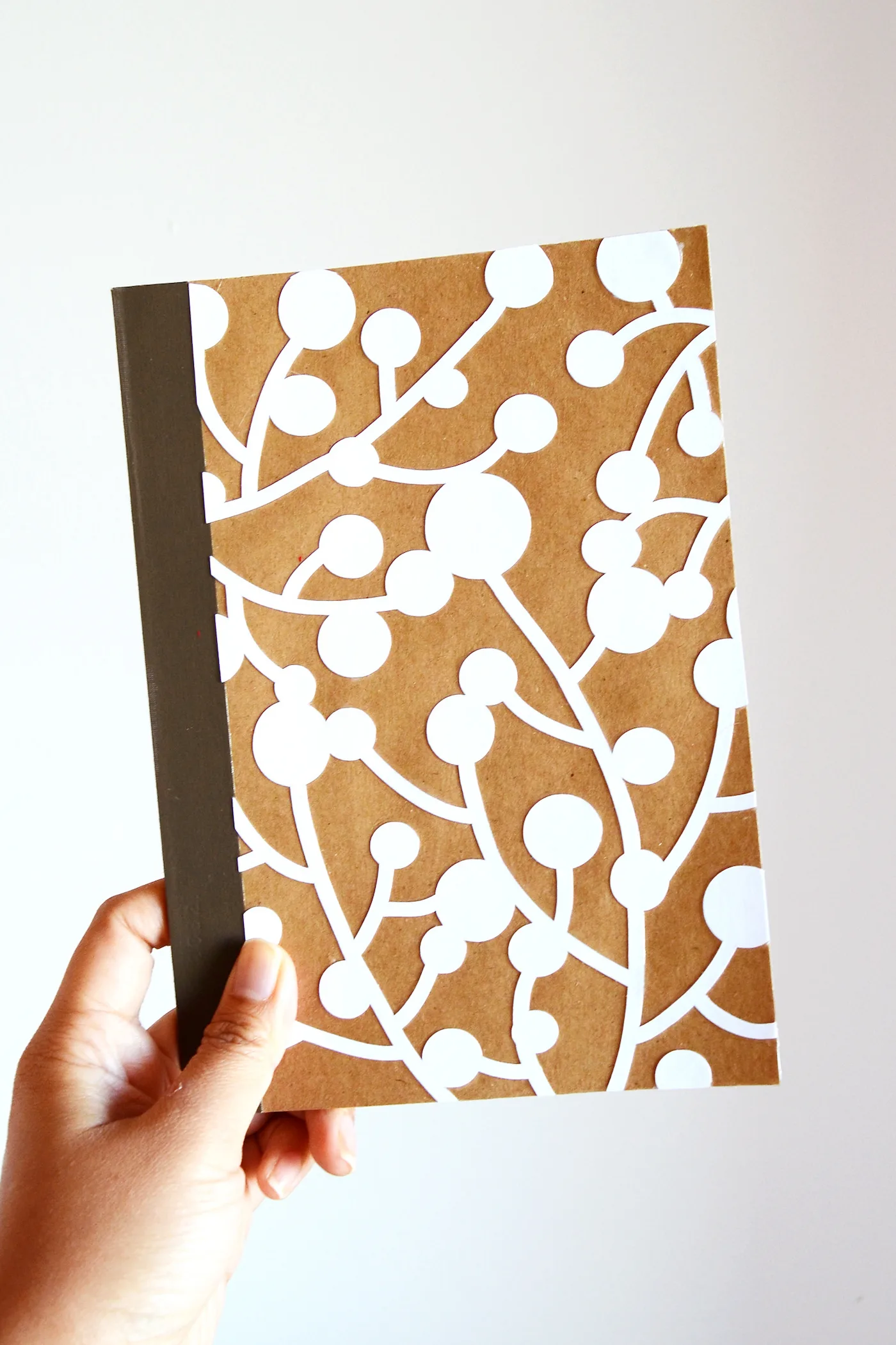 how to decorate a notebook cover with lasercut paper and Mod Podge