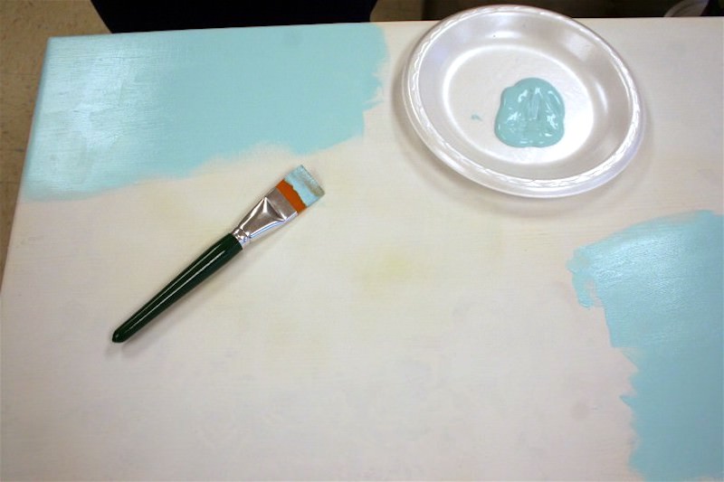 Painting a tabletop with light blue paint
