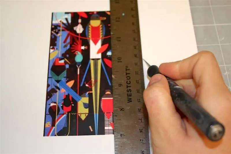 Trimming an image out of paper using a ruler and craft knife